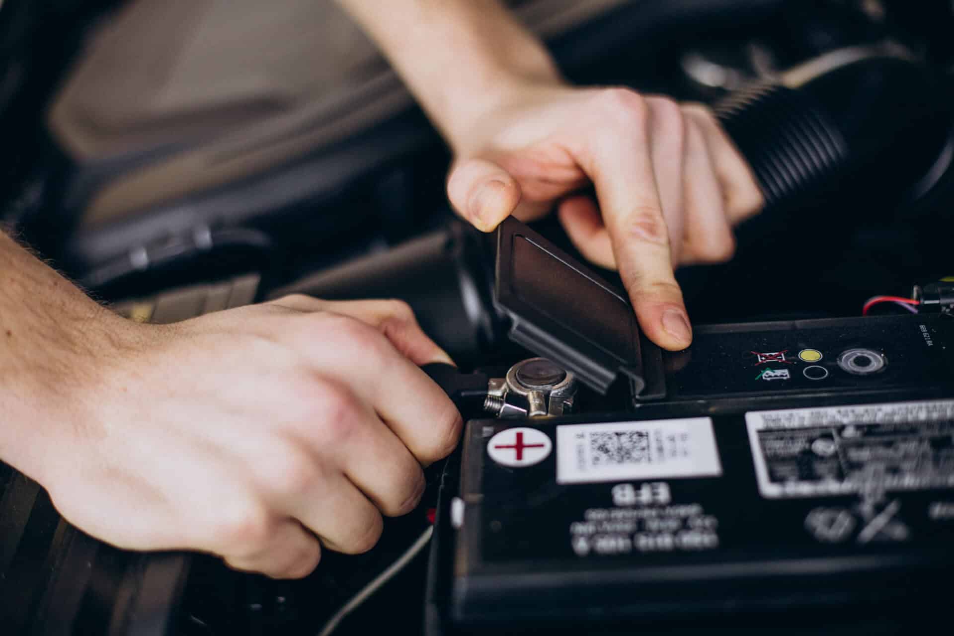 a man checking car battery life cycle